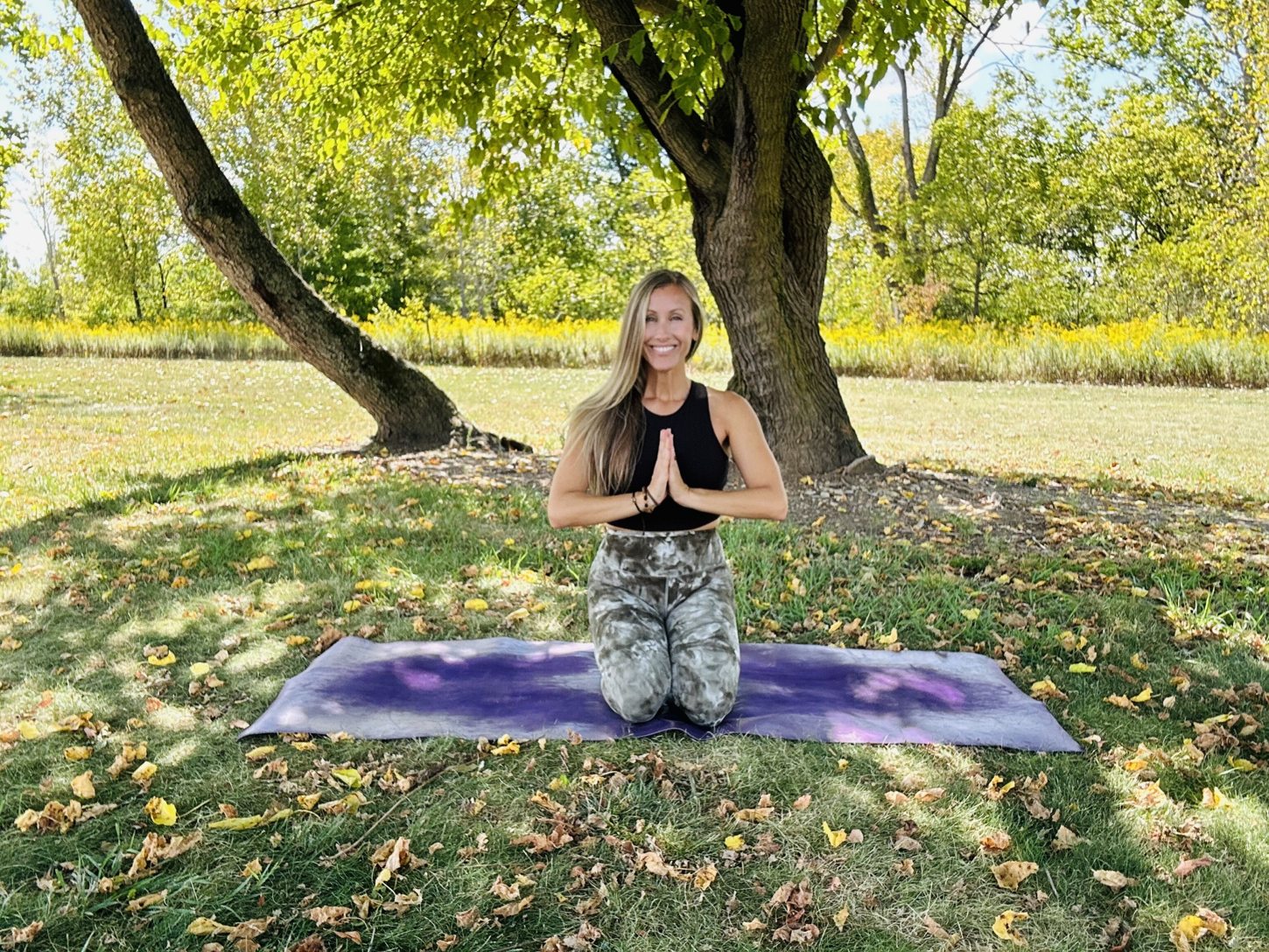 Elizabeth practicing yoga outdoors